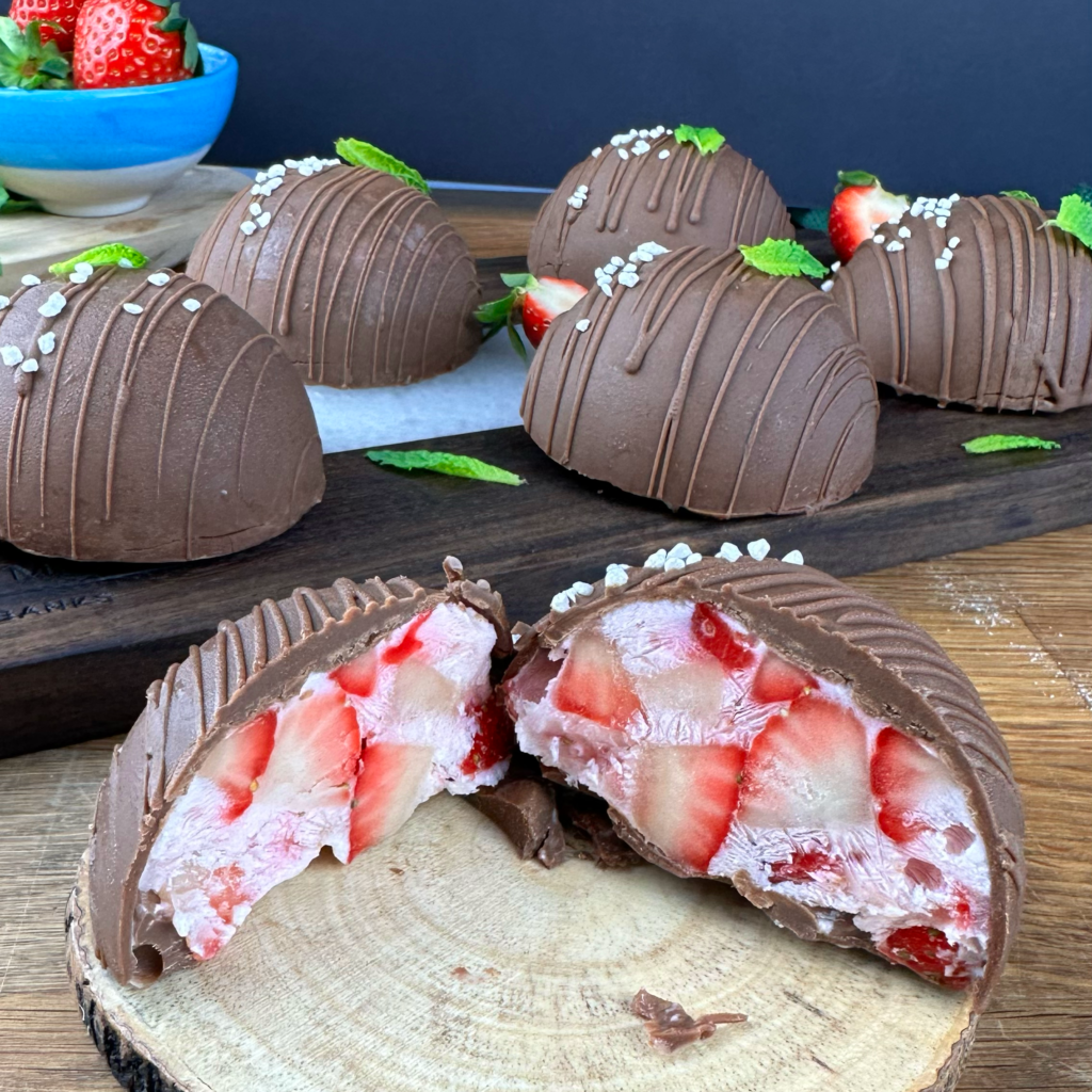 Frozen Strawberry Yogurt Gem cut in half, revealing the creamy filling.