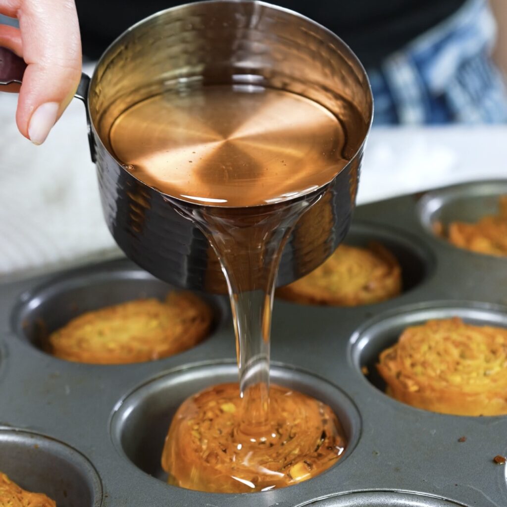 Golden-brown baklava rolls soaked in syrup.