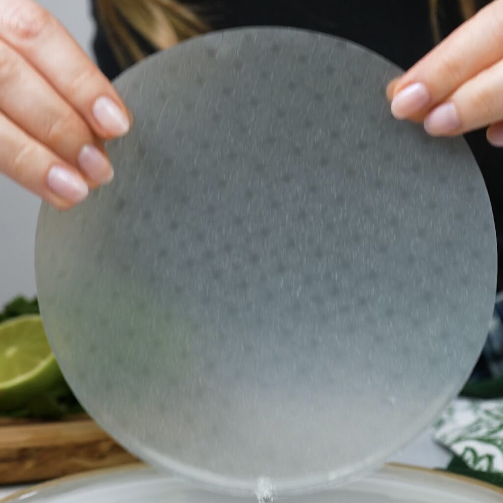 Dipping rice paper into water for mini quiches