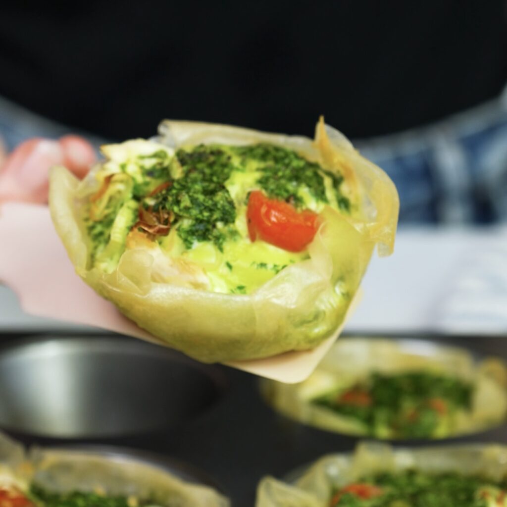 Freshly baked mini rice paper quiches in muffin tin