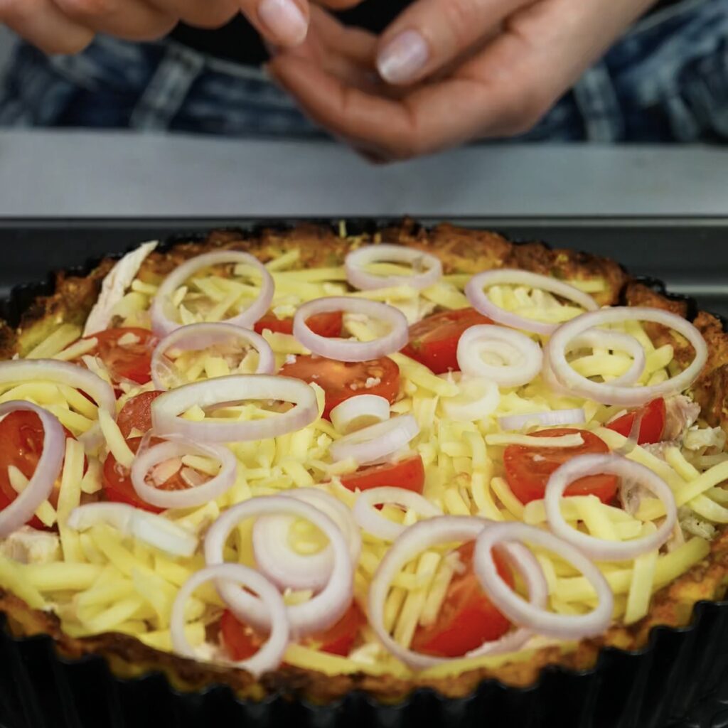 Potato crust filled with chicken, cheddar, tomatoes, and shallot