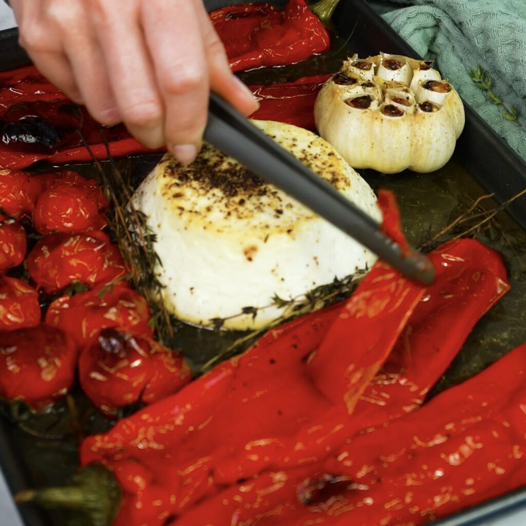 Peeling skin from roasted peppers and tomatoes.