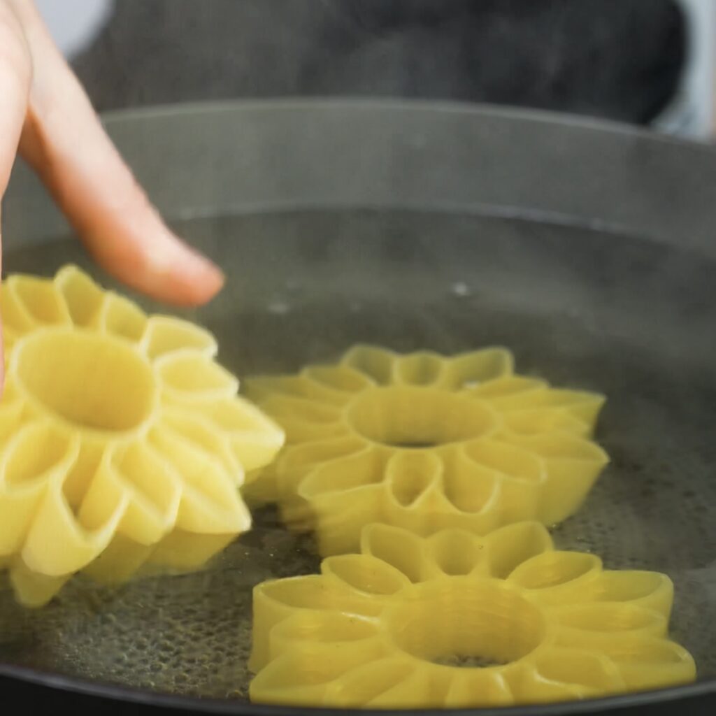 Boiling pasta in salted water.