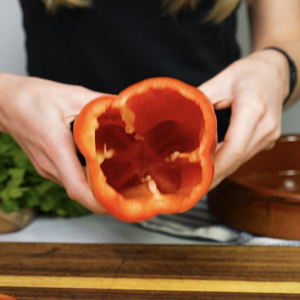 Hollowed-out red pepper with stem, core, and membranes removed