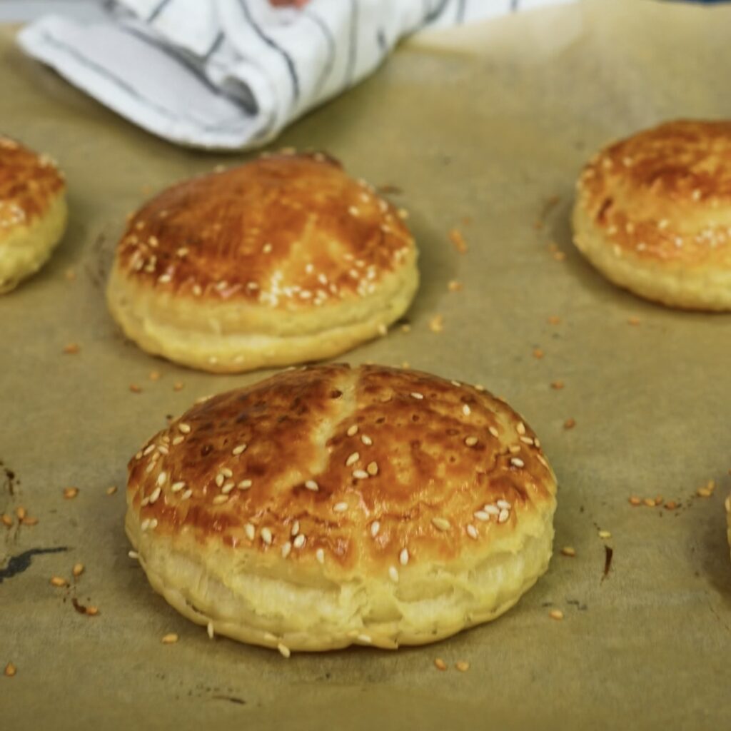 Golden puff pastry circles baked and puffed