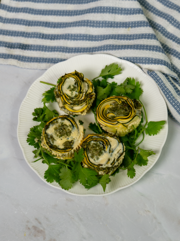 Courgette and yellow squash rolls served on a plate