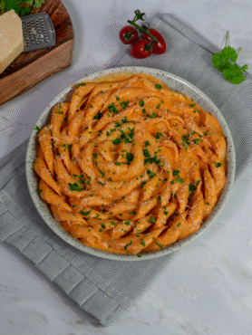 Creamy roasted tomato and cottage cheese fusilli served on a plate