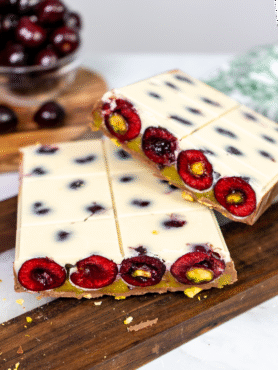 Picota Cherry Pistachio Chocolate Bar sliced in half, showing layered interior