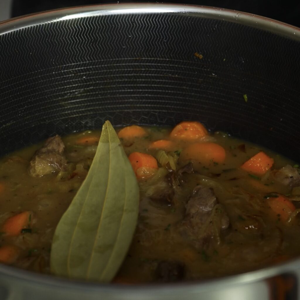 Lamb sauce simmering in a pot.