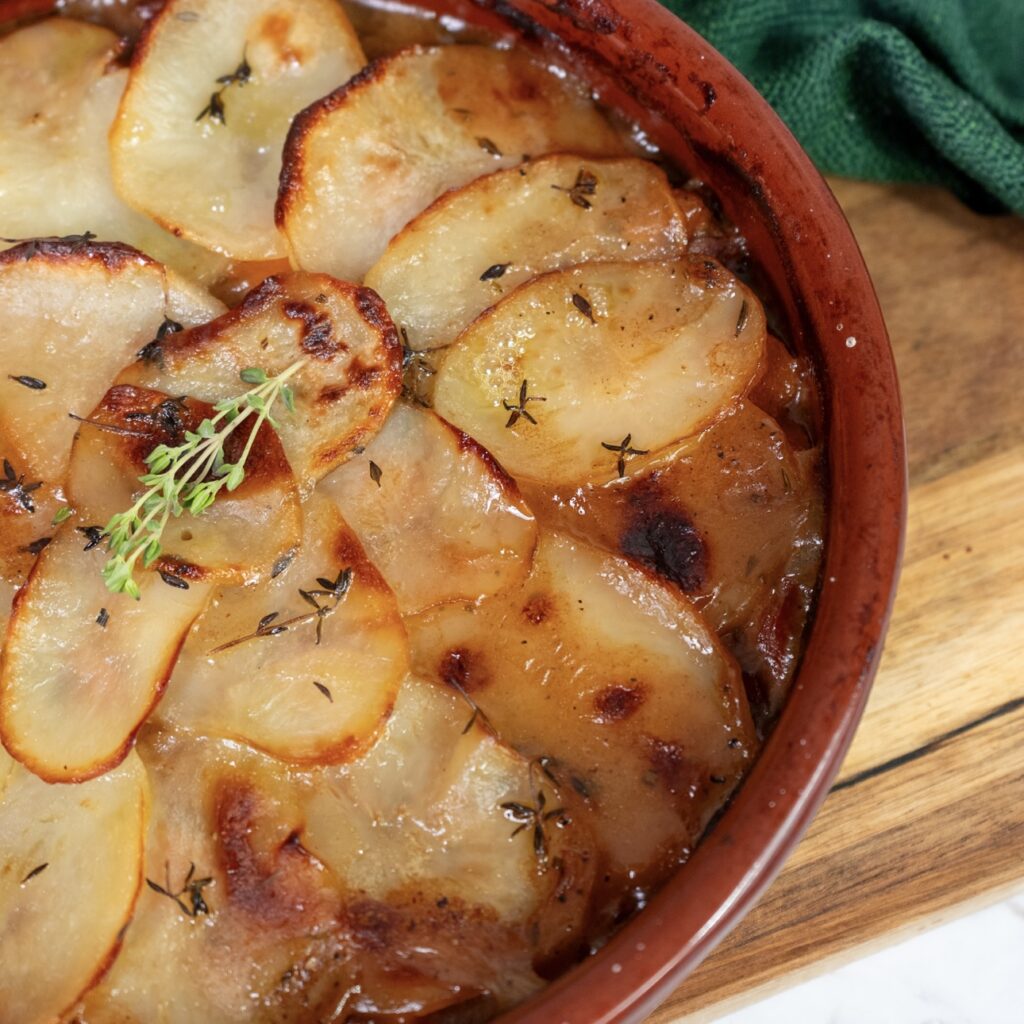 Baked Lancashire Hotpot with golden potato topping.
