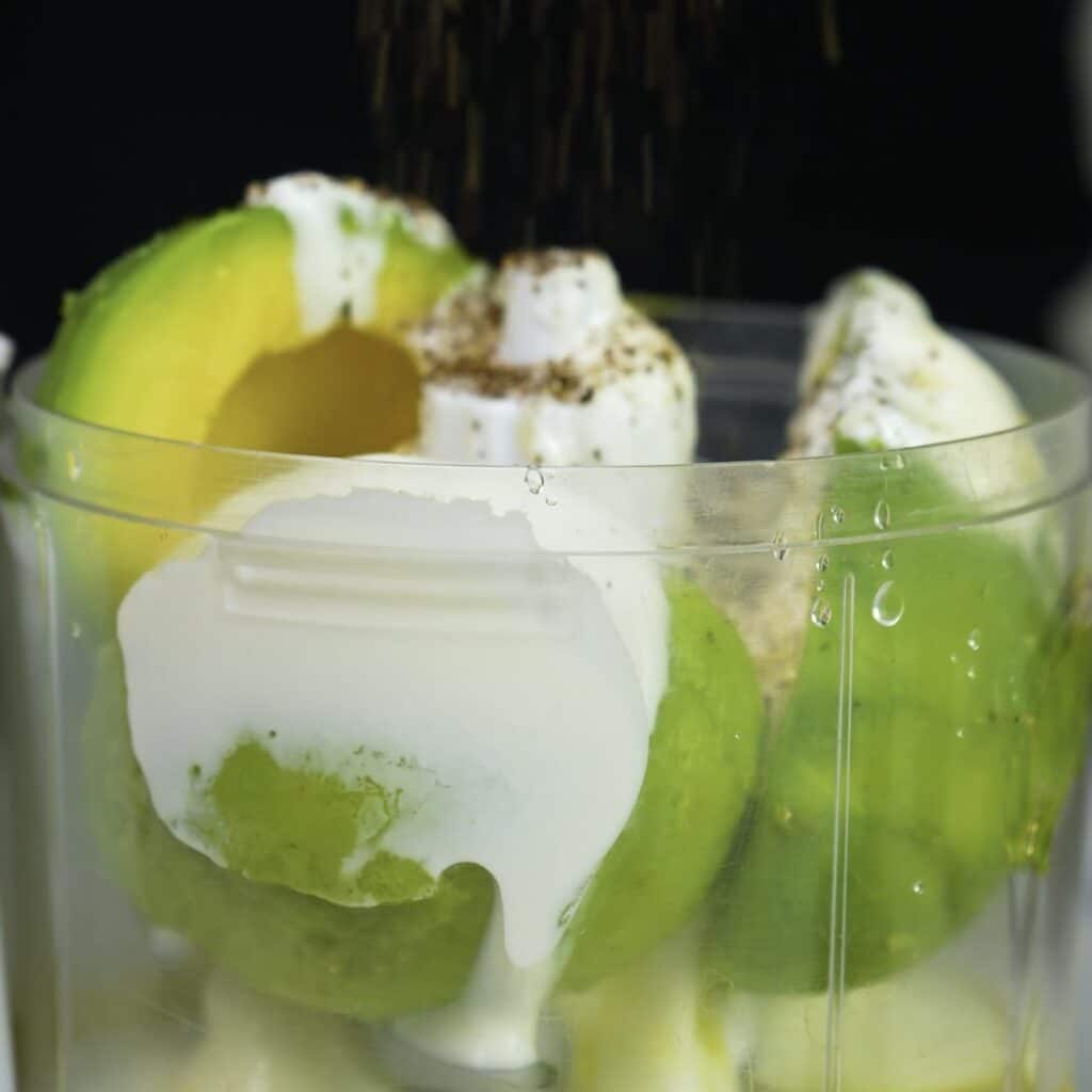 Avocado, yoghurt, lemon juice, and olive oil in a food processor before blending