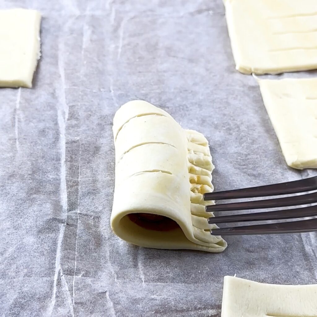 Crimping puff pastry edges with a fork