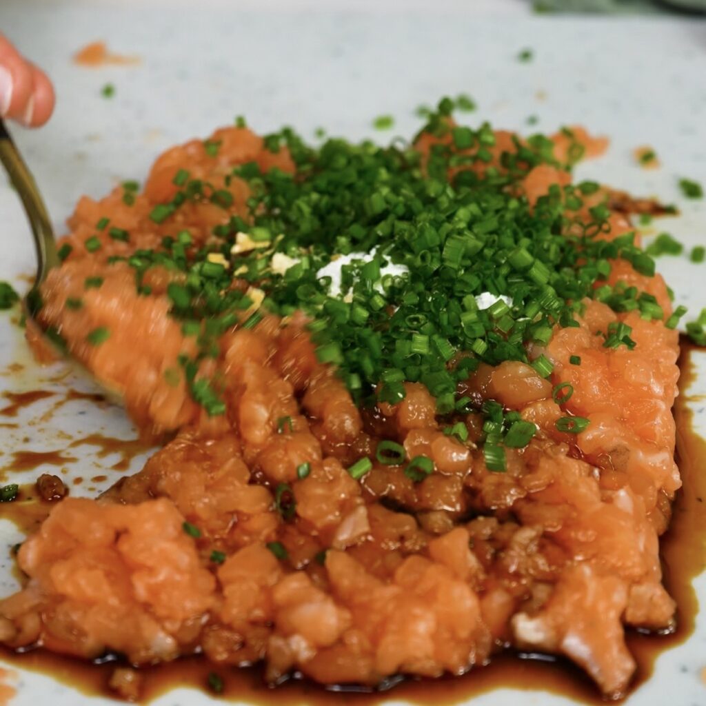 Minced salmon mixed with chives, soy sauce, garlic, and ginger for crispy salmon squares