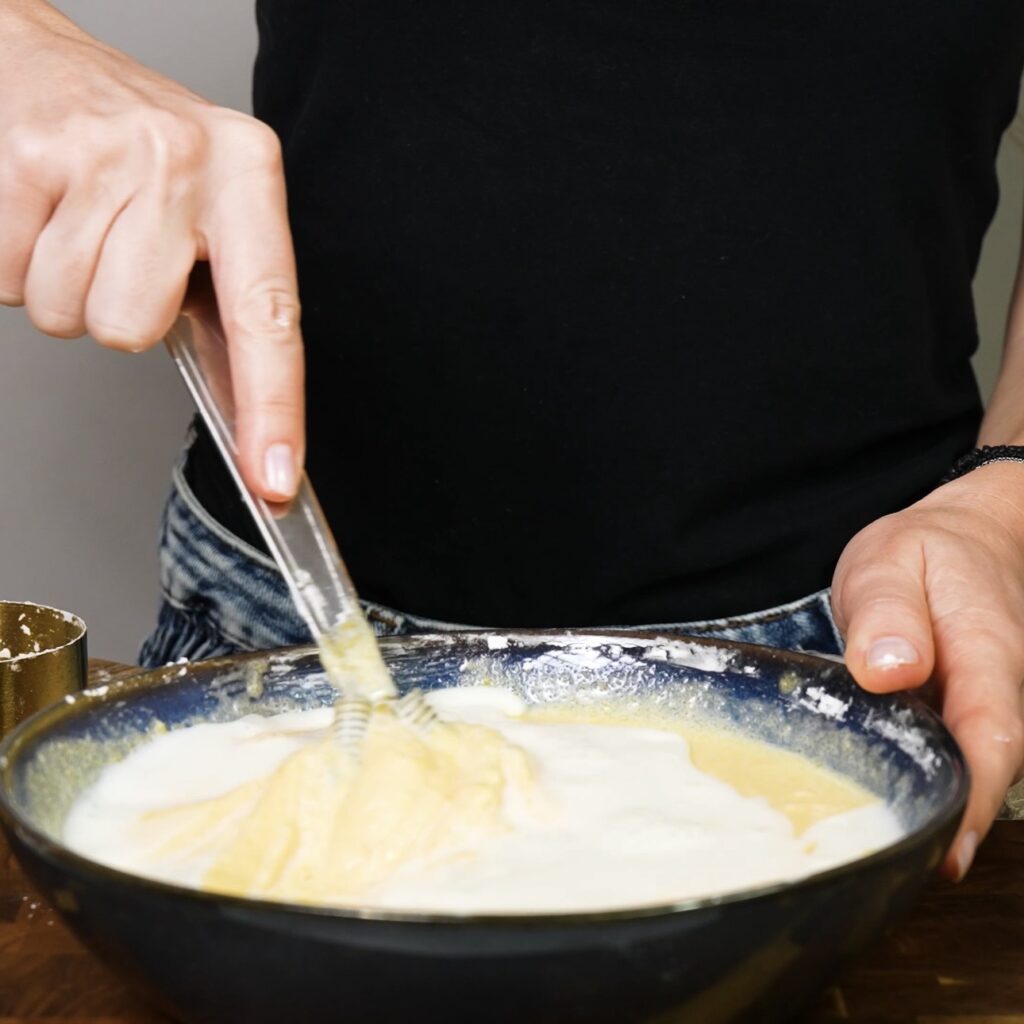 Loosening egg yolk mixture with milk