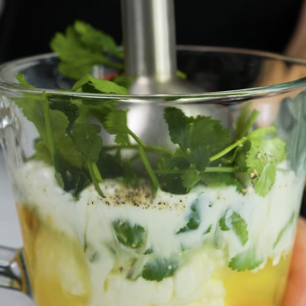 Blending eggs and cottage cheese to make the quiche filling