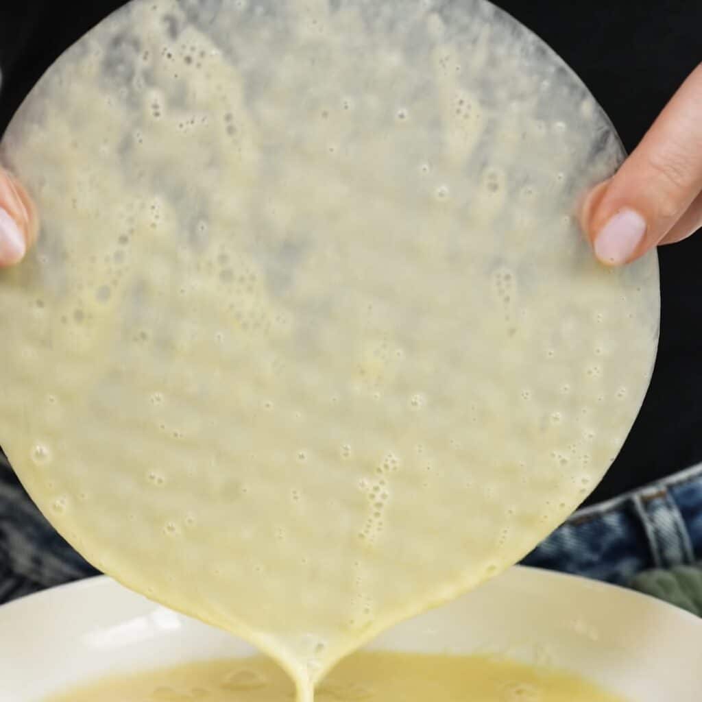 Rice paper sheet dipped into egg mixture