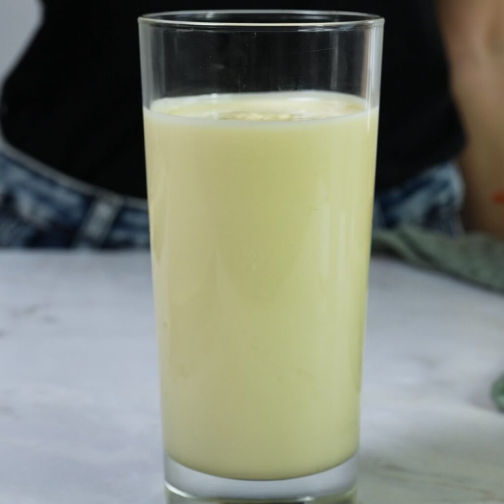 Melted chocolate in a glass ready for dipping yogurt bars
