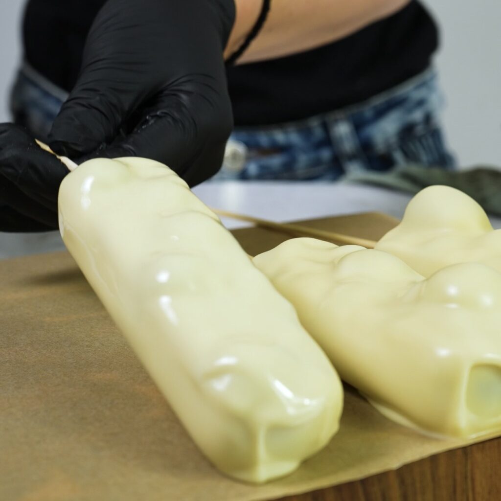 Place chocolate coated yogurt bars on a parchment lined tray