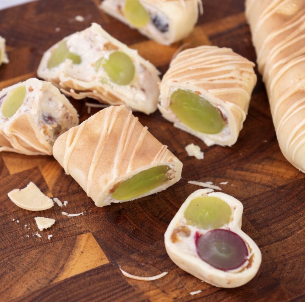 Sliced grape yogurt bars showing creamy interior with grapes