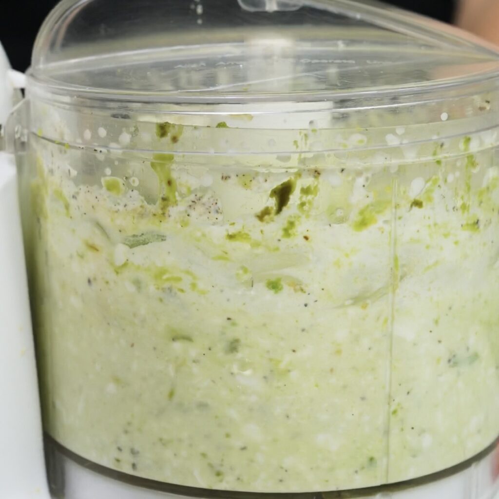 Blending cottage cheese and avocado into a smooth spread