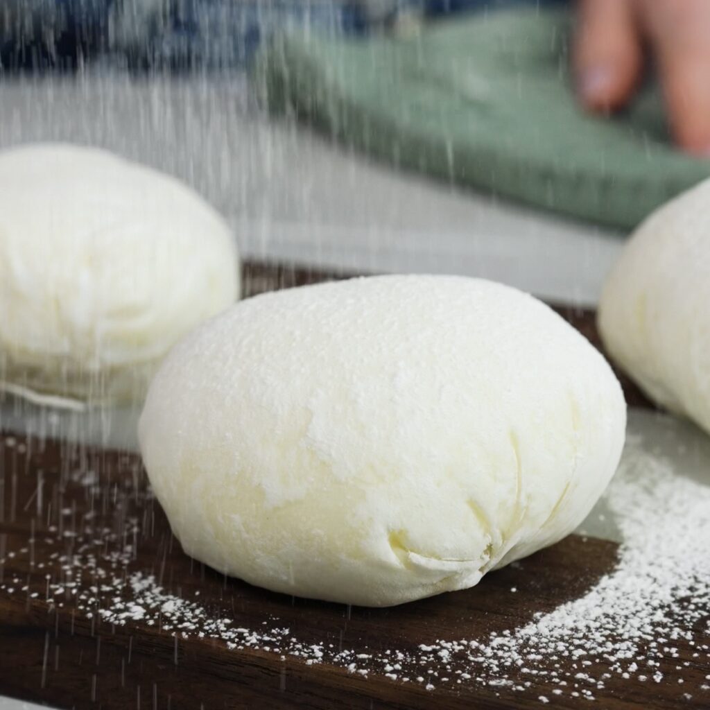 Mango mochi dusted with cornflour and icing sugar on top