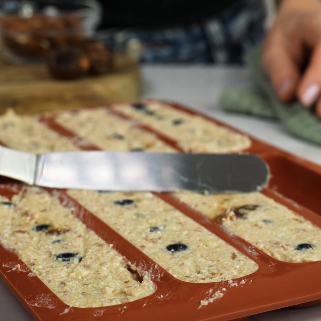 Cottage cheese mixture spread over blueberries and smoothed in silicone mould