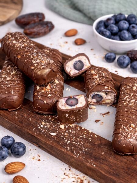 Chocolate blueberry protein bars served on a wooden board