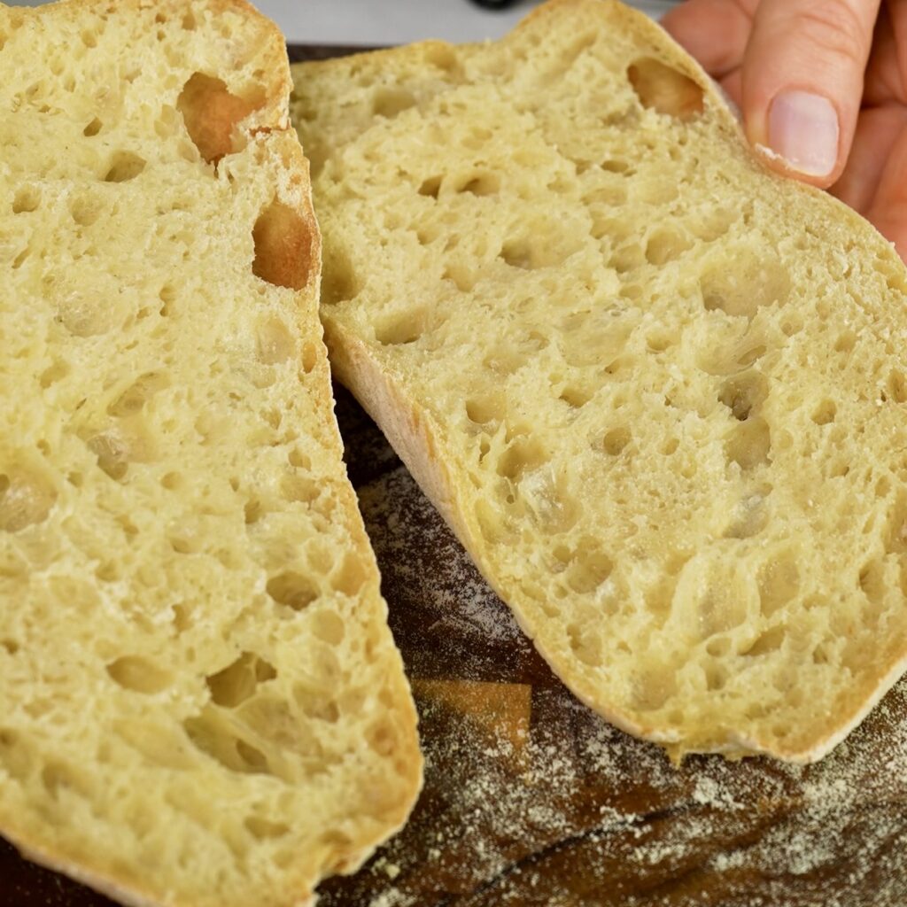 Ciabatta sliced open showing airy crumb structure