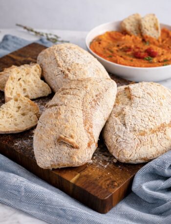 Ciabatta loaves on a wooden board