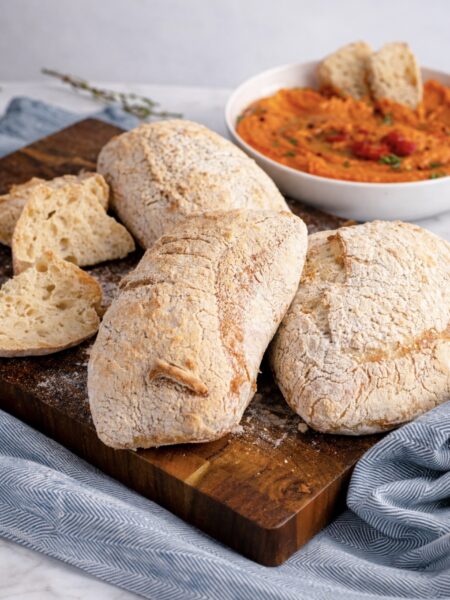 Ciabatta loaves on a wooden board