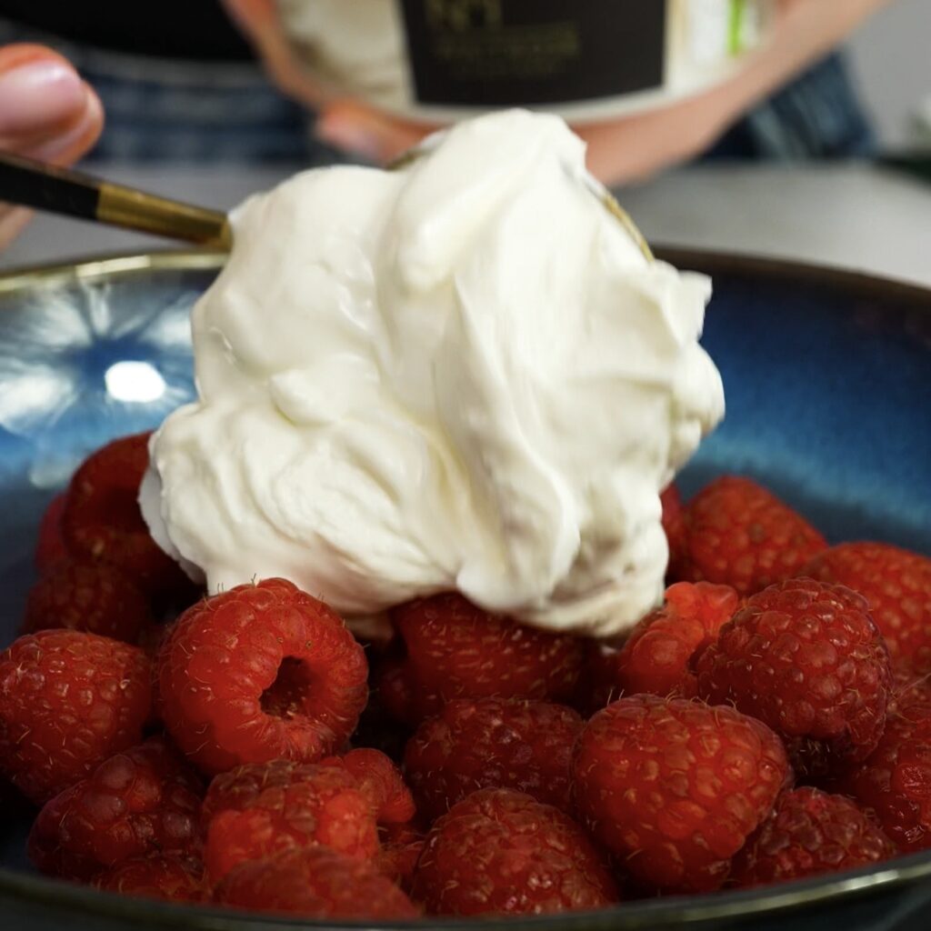 Adding yogurt to raspberries for the filling