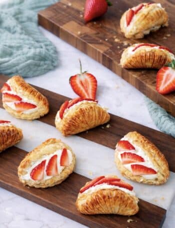 Strawberry cream cheese shells served on a wooden board