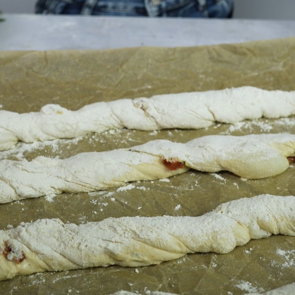 Twisted no-knead bread on baking tray ready to bake
