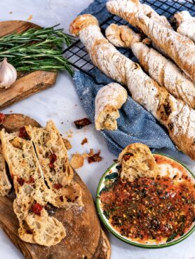 Baked sun-dried tomato rosemary bread twists served with dipping oil