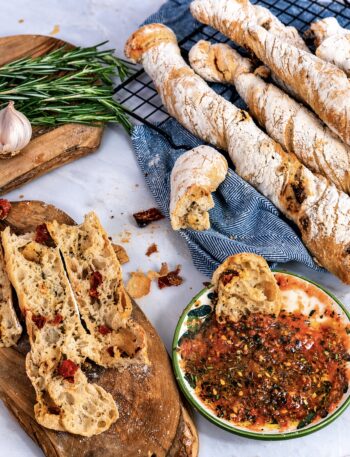Baked sun-dried tomato rosemary bread twists served with dipping oil