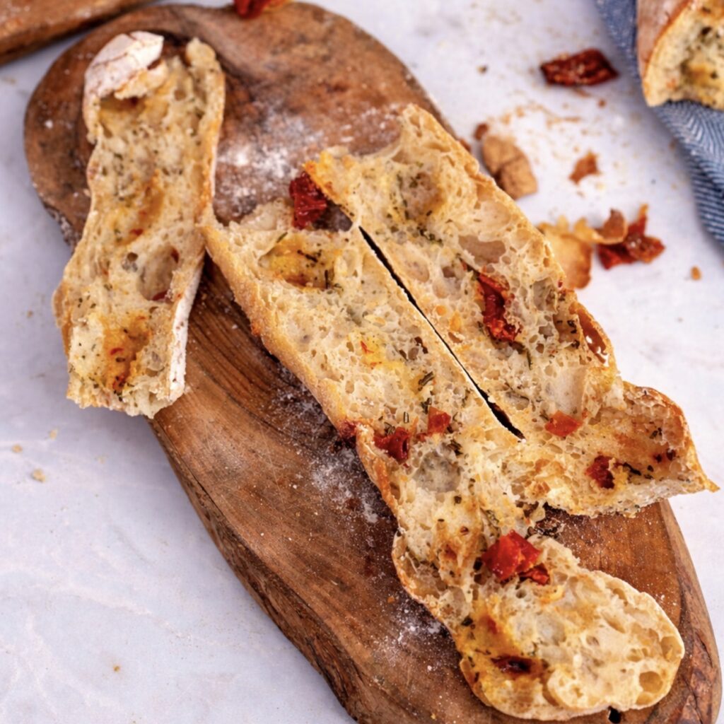 Bread twist sliced in half lengthwise showing soft airy crumb