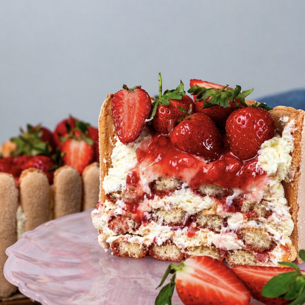 Slice of strawberry tiramisu cake showing creamy layers and filling