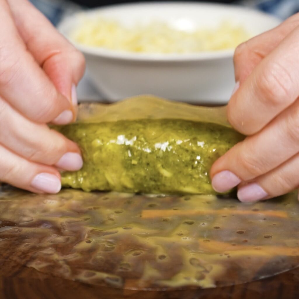 Wrapping a second layer of rice paper around the mozzarella stick