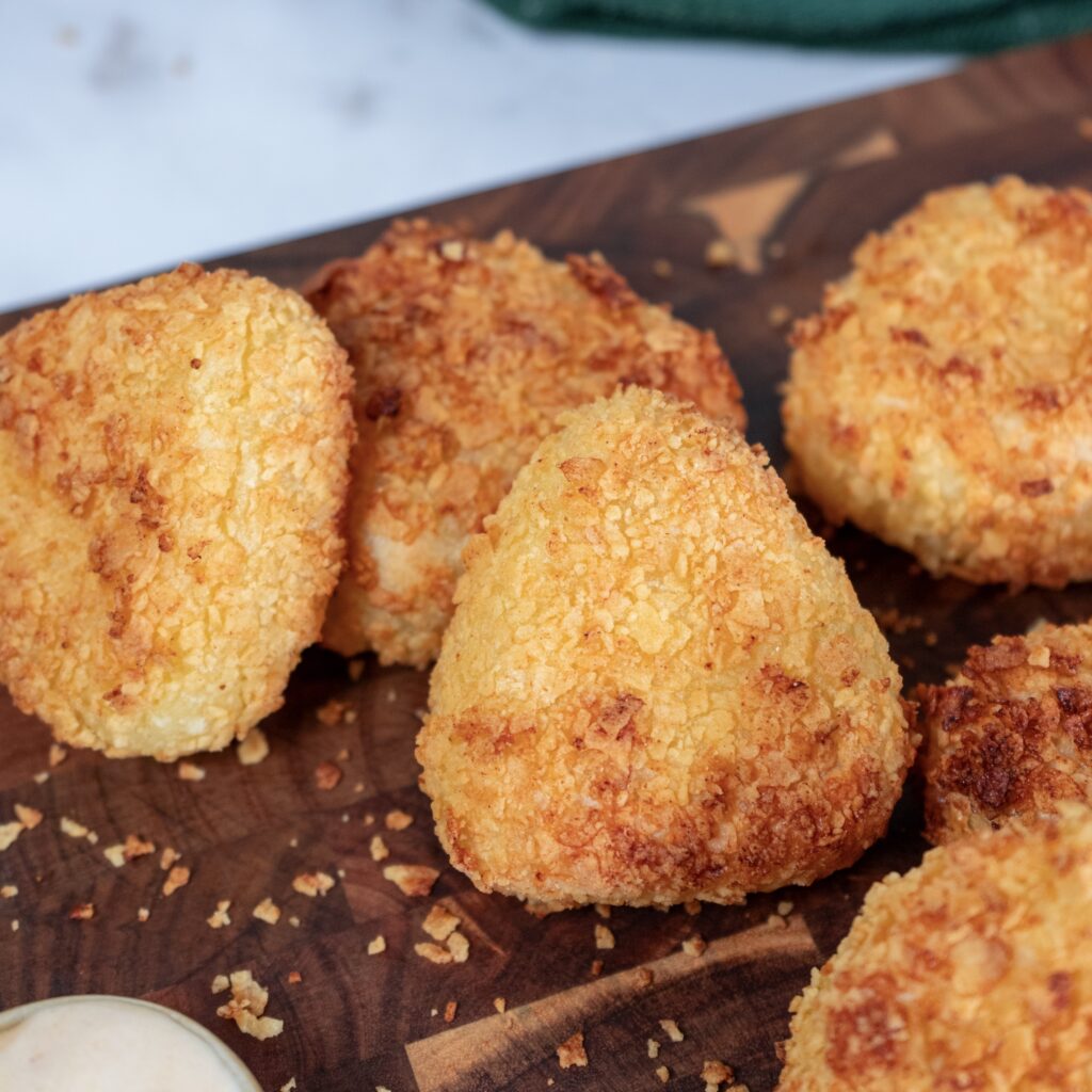 Crispy cheesy potato triangles with golden coating