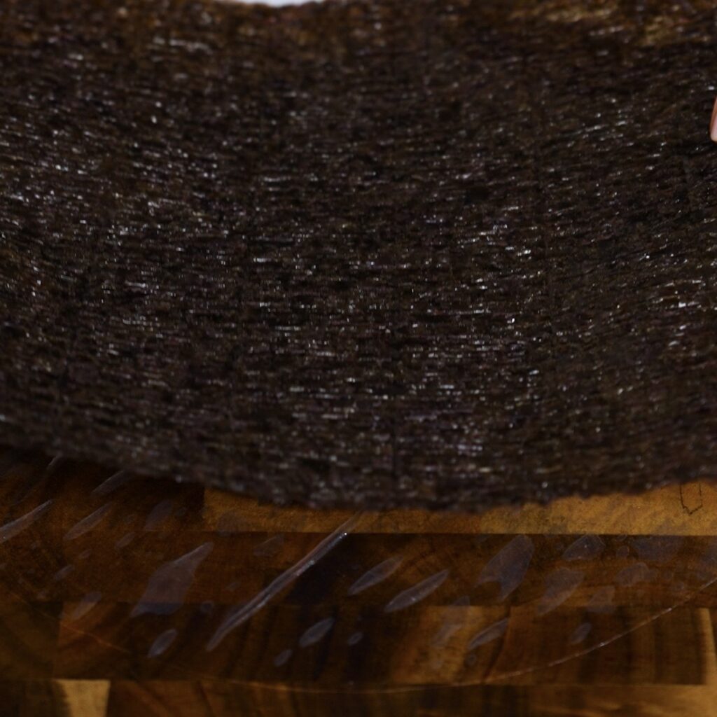 Placing a nori sheet onto softened rice paper for Air Fryer Salmon Sushi Parcels