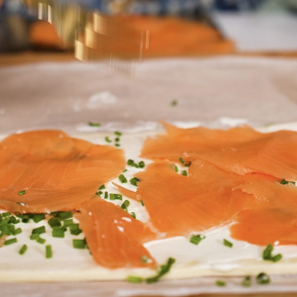 Puff pastry layered with cream cheese, chopped chives and smoked salmon.