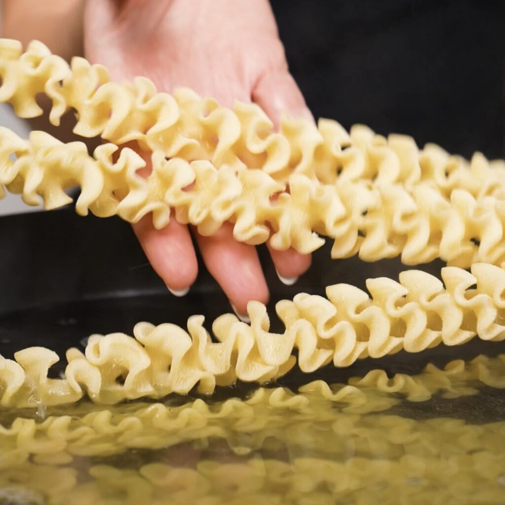 Pasta boiling in a pan of salted water