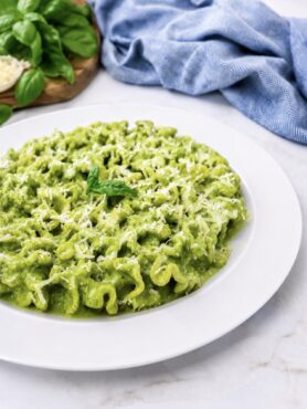 Creamy cottage cheese pesto pasta served on a plate