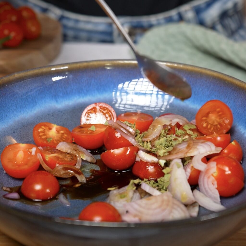 Cherry tomatoes and shallots mixed with balsamic vinegar, olive oil and dried basil.