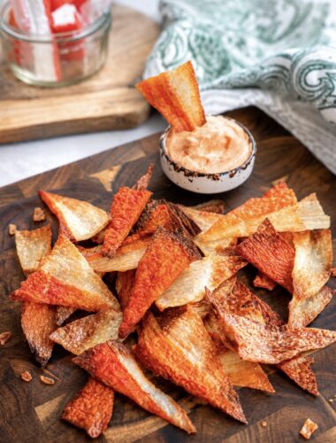 Crispy Air Fryer Crab Stick Chips served on a wooden board with sriracha mayo dip.