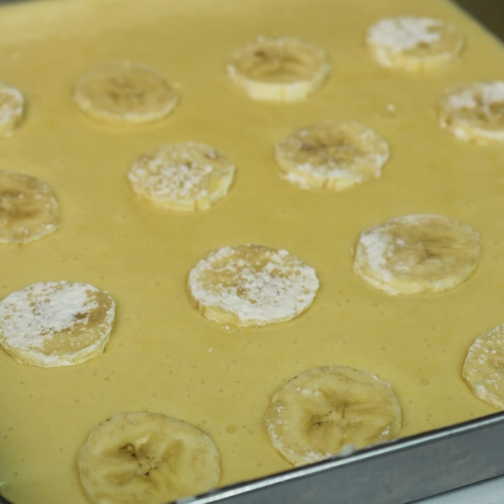 Banana slices added on top of cake batter.