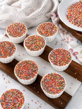 Banana Dot Cakes arranged on a wooden board.