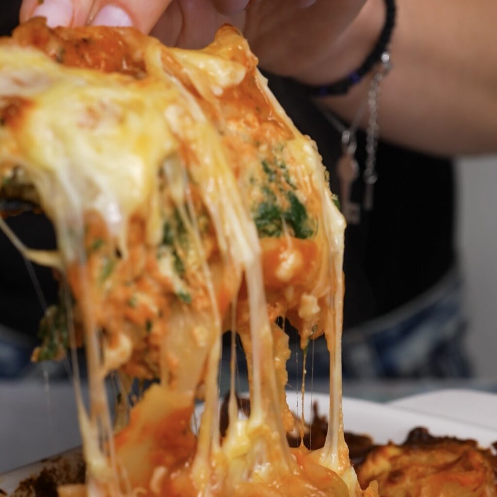 Cheese pull from baked easy spinach and ricotta lasagna
