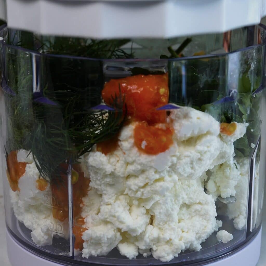 Blending the cottage cheese filling for stuffed tomatoes
