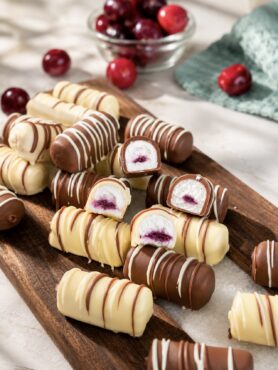 High-Protein Cottage Cheese Cherry Bars served on a wooden board.